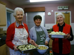 Liz Hanlon, Judith Hegan and Grace Bowers help prepare the Indian meal at the Agherton Parish Curry Party.